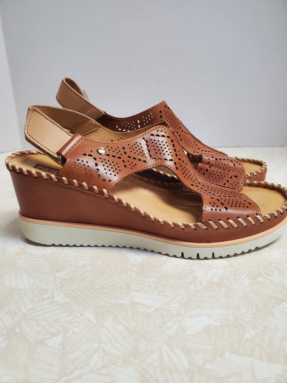 PIKOLINOS Perforated Leather Wedge Sandals in Cognac